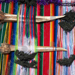 Lama bones on colorful loom