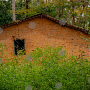 Adobe house with a small window