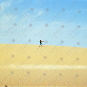 Woman standing on a dune in Western Sahara